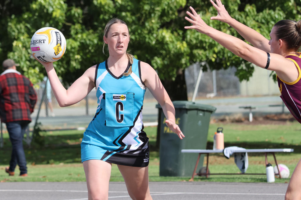 Rylee Cocks looks to pass the ball off.