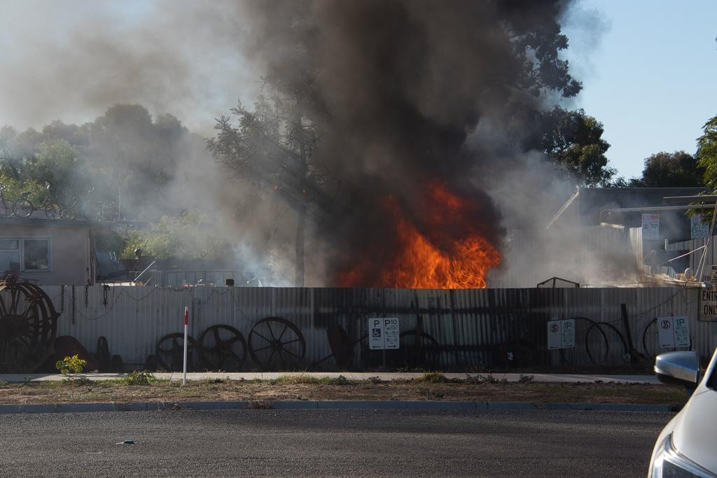 Firefighters work hard to control the incident when a car was reported to be on fire in Warracknabeal. Photo: ALISON EY