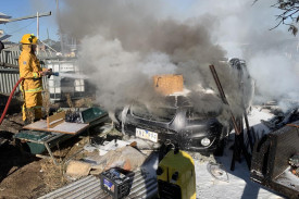 Firefighters work hard to control the incident. Photo: DAVID WARD