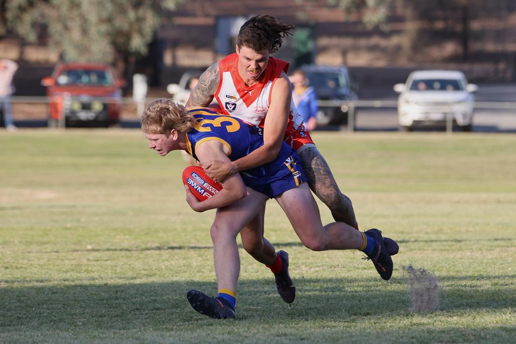 Taylors Lake's Mitchell Crough tackles Natimuk's Archie Sudholz