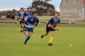 Nathaniel Dickinson and Joseph Knoll in a race for the ball.