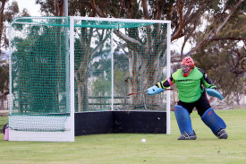 Horsham Jets’ goalkeeper Jennifer Taylor watches a wayward shot safely pass her goal.