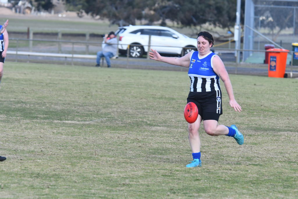 Minyip Murtoa's Madison Churchill launches a kick upfield.