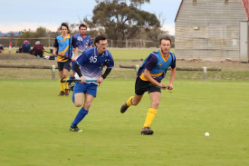 Kaniva’s Nathaniel Dickinson and Nhill’s Joseph Knoll in a race for the ball.