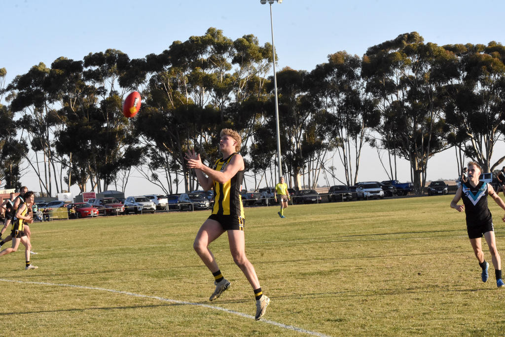 Pimpinio's Thomas Baker prepares for the mark.