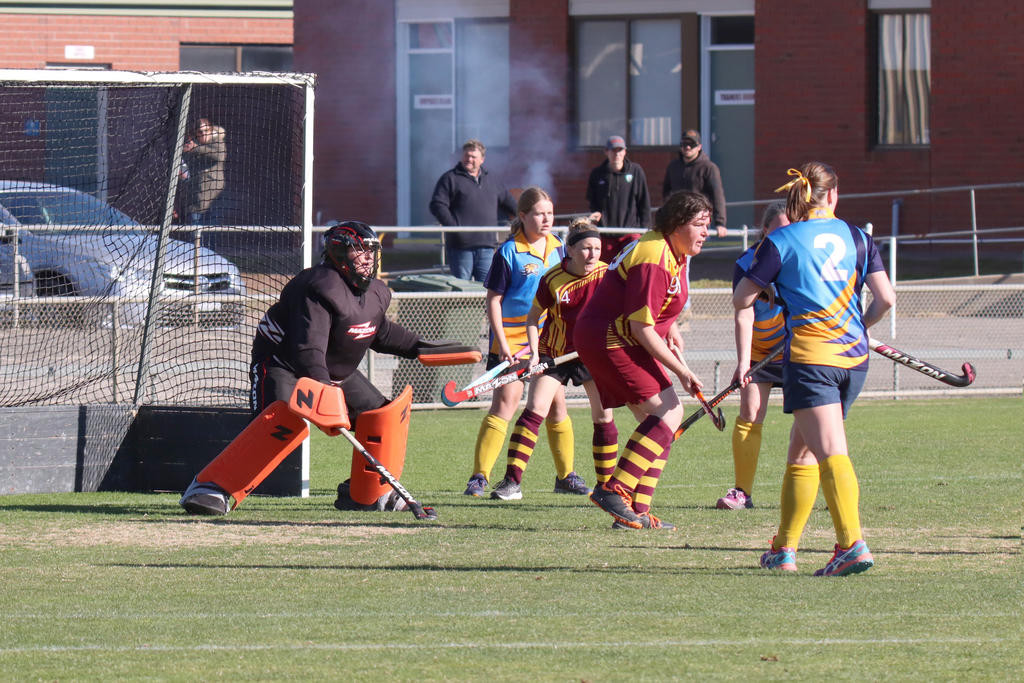 Warrack goalkeeper Mel Bentley and defenders Kate Williamson and Jess Boyd brace to repel another Nhill Thunderbirds’ attacking drive.