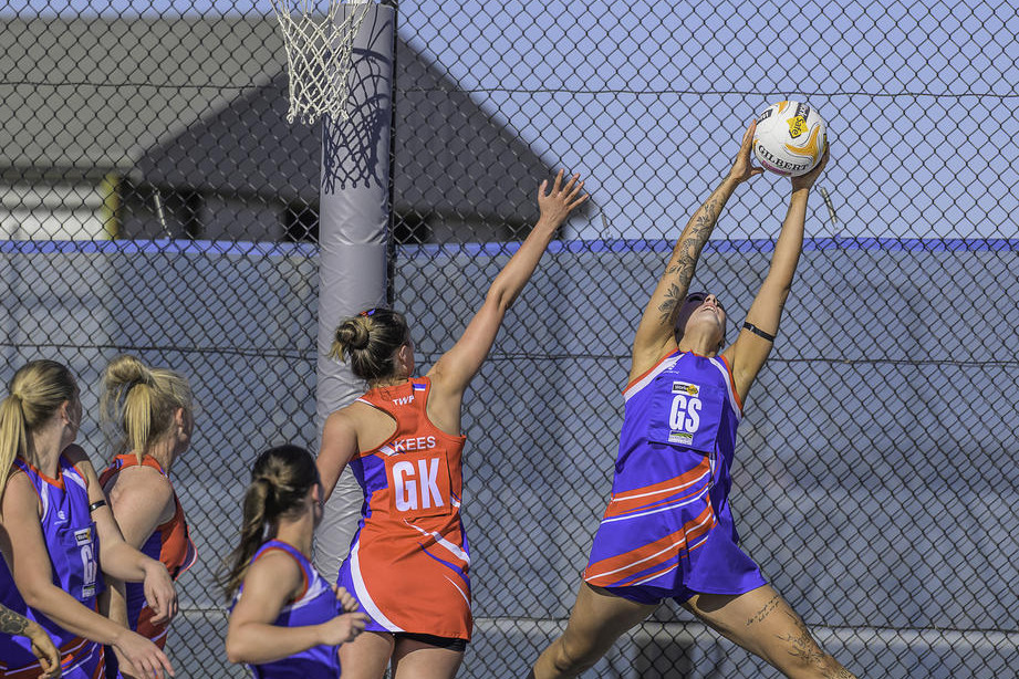 Zanaiya Bergen leaps for the ball in the goal circle.