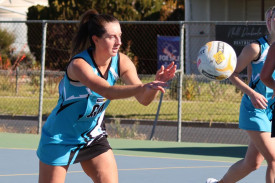 Steph Thompson passes the ball.