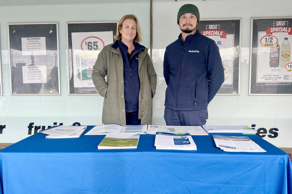 VicGrid representatives Marg and Geoff Caine set up the community consultation desk in front of the Rainbow supermarket on Thursday, June 12, to discuss the Draft 2025 Victorian Transmission Plan.