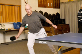 Warrack’s Trevor Hemer makes a forehand return on Monday night.
