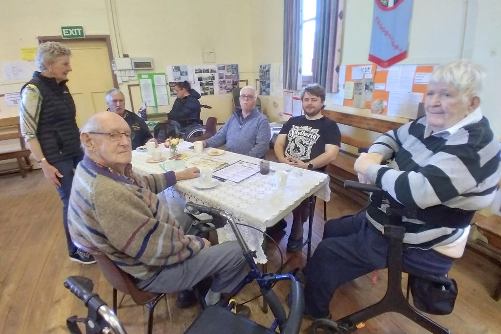 Mira and local men at the Biggest Morning Tea earlier this year.
