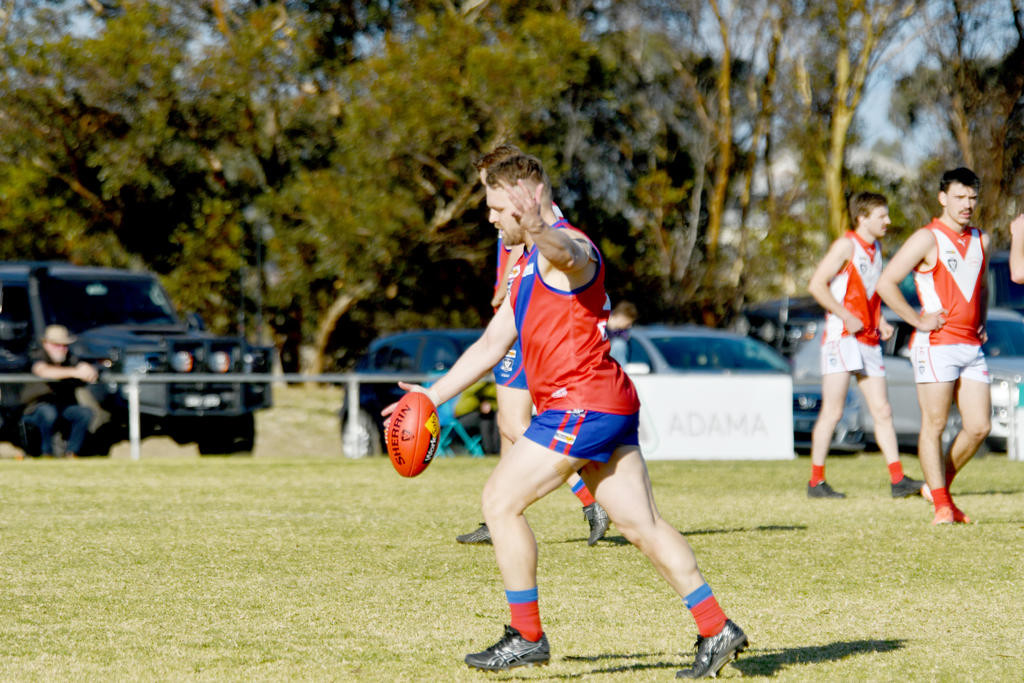 Kalkee's Andy Devereaux goes to kick for goal.