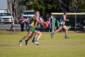 Dimboola’s Andrew Moore looks to send the ball deep into his side’s forward 50.