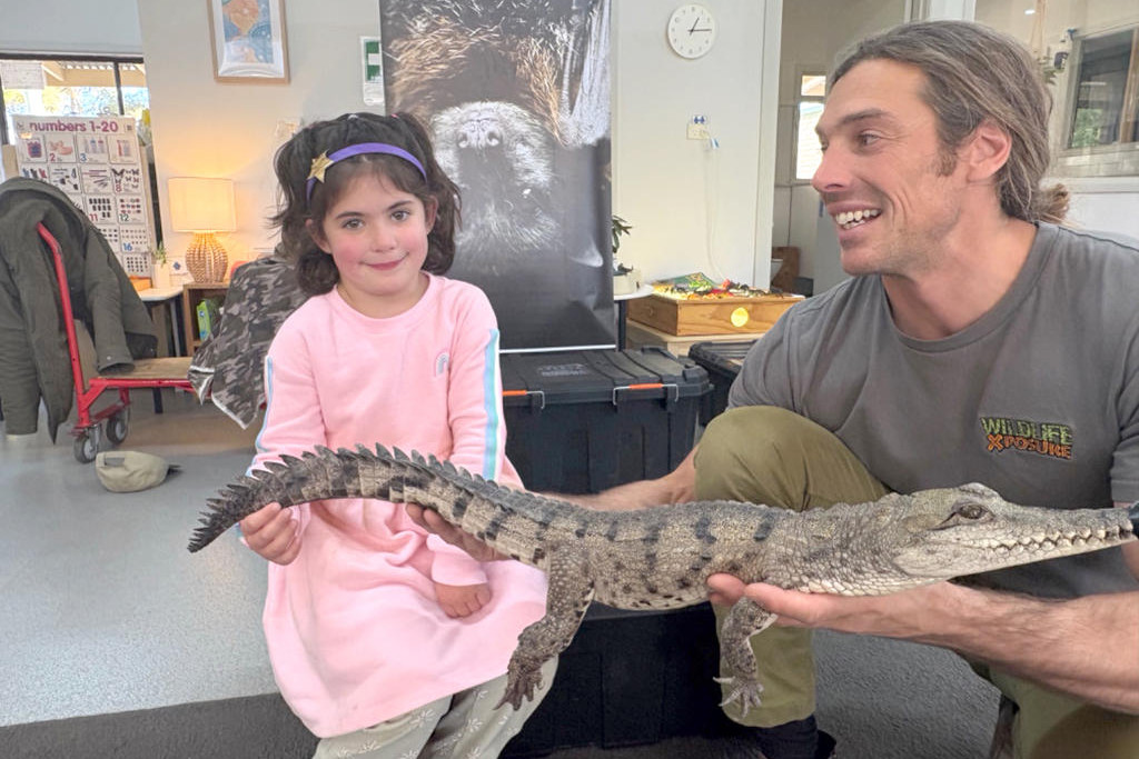 Maisie holding Little Johnny the Freshwater crocodile.