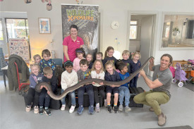The whole Hopetoun Kinder class gets a picture with Ace the Olive Python.