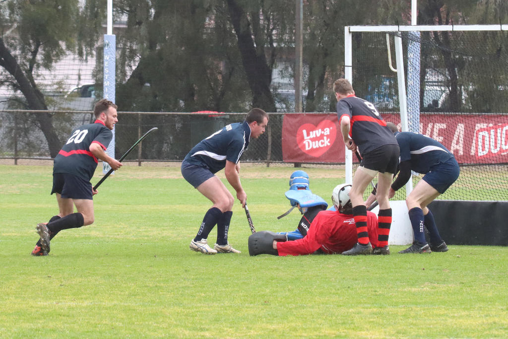 Horsham Hurricanes’ goalkeeper Colin Williams does whatever he needs to do to block another Tigers attempt at scoring.