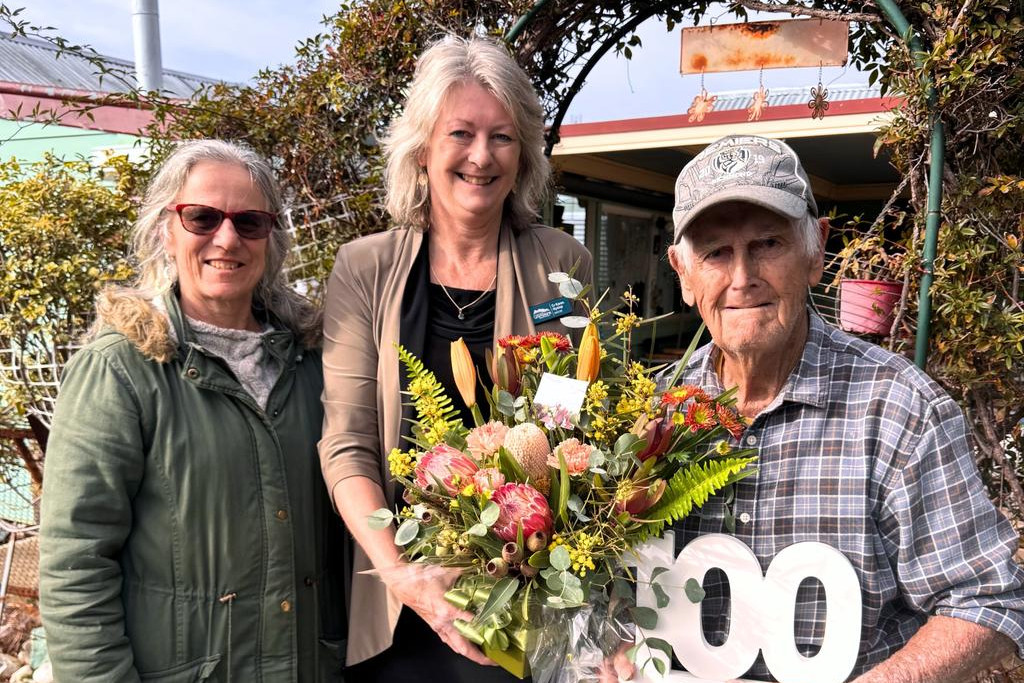 Northern Grampians Shire mayor Karen Hyslop, centre, and Cr Karen Probst congratulate St Arnaud’s Kevin Allen on his 100th birthday.