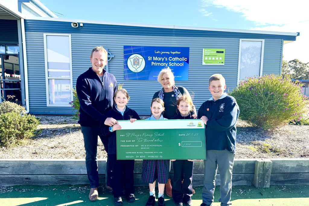 WG & SF McPherson PTY LTD Managing Director Chris McPherson and St Mary's Primary School principal Julie Leonard with students (from left) Maddison McPherson, Matilda Lang, Remy Milne and Hudson Clyne.