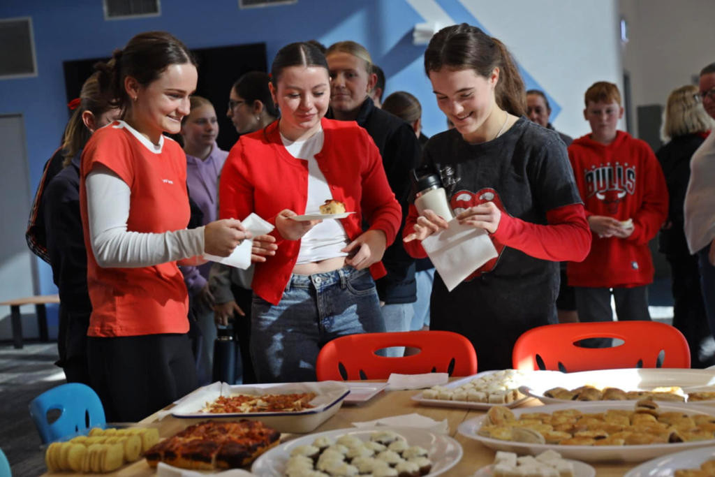 Hopetoun P-12 College students Issy, Jade and Lana during the farewell tea for the outgoing principal, Graeme Holmes.