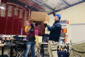 Natimuk Field and Game Club President Bill Jorgenson and Tommy with an auction item at the charity day for MND