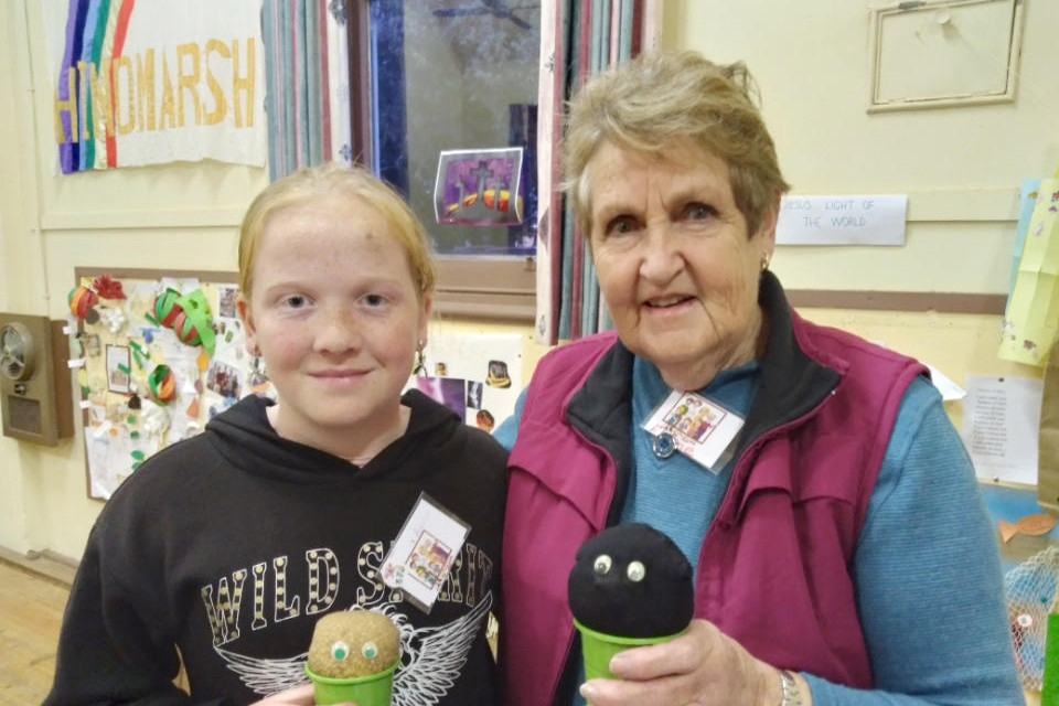Adalyn Clugston with Elaine Nitschke and their newly planted “Wheat heads”.