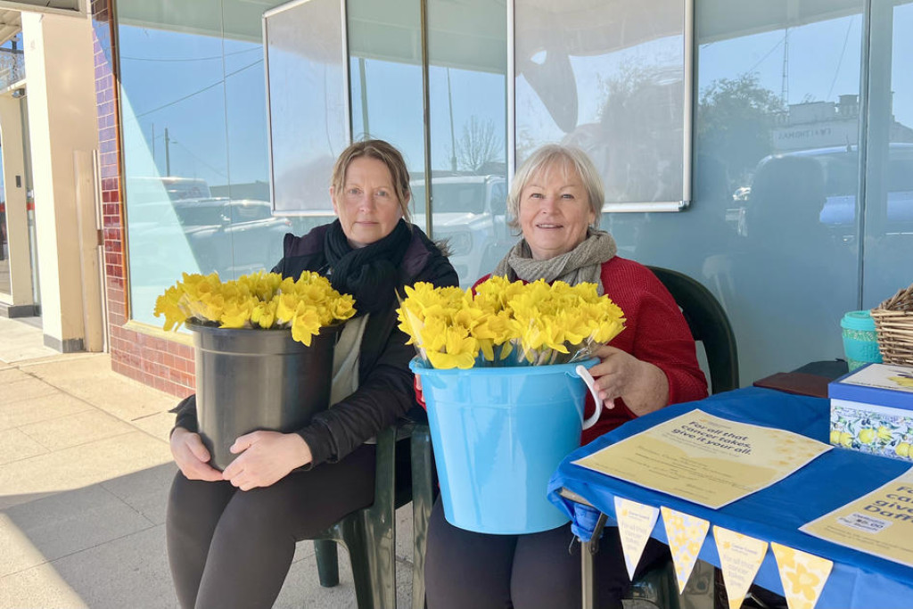 Caroline Cocks and Karen Barton were selling Daffodils to raise money for the Cancer Council in front of the Rainbow Supermarket on Daffodil Day, Thursday, August 21.