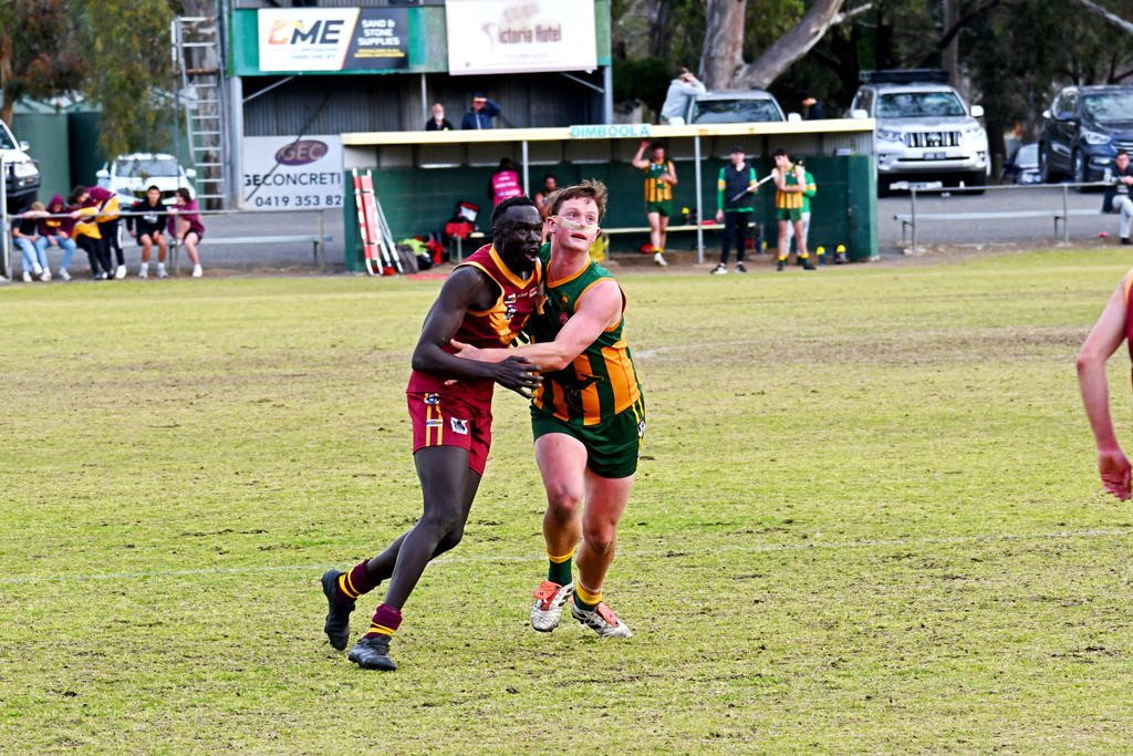 Warrack Eagles' ruck Machok Garang battle for position with Dimboola's Patty MacDonough.