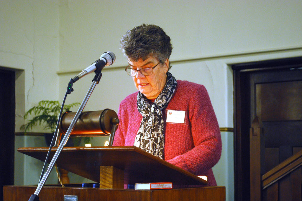 Rhonda Altmann does the scripture reading.
