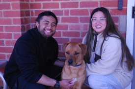 Henry Vaitohi whose father was minister 1995-99 with his dog Koda and partner Elizabeth Yeo.