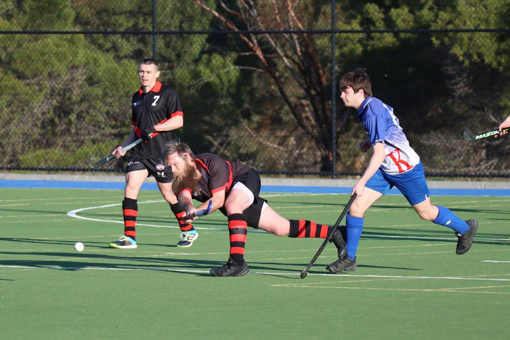 Horsham Hurricanes’ Aaron Mullane clears the ball out of defence.