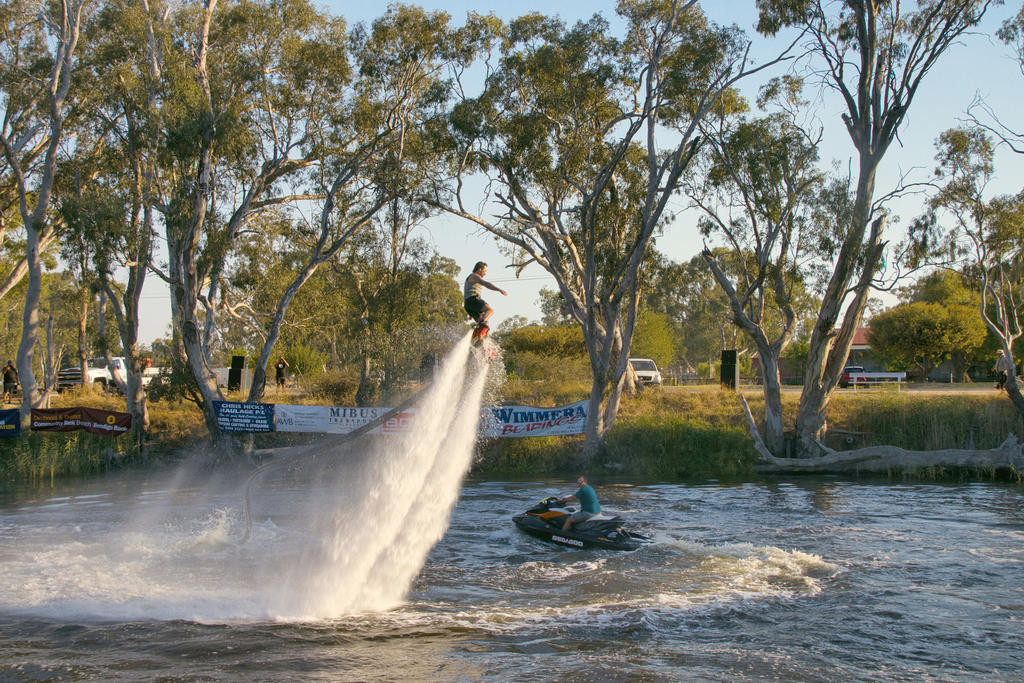 Flyboard pilot Connor Rodgers shoots up into the air as he prepares his somersault routine during the Peter Taylor Memorial Barefoot Waterski tournament in 2024.