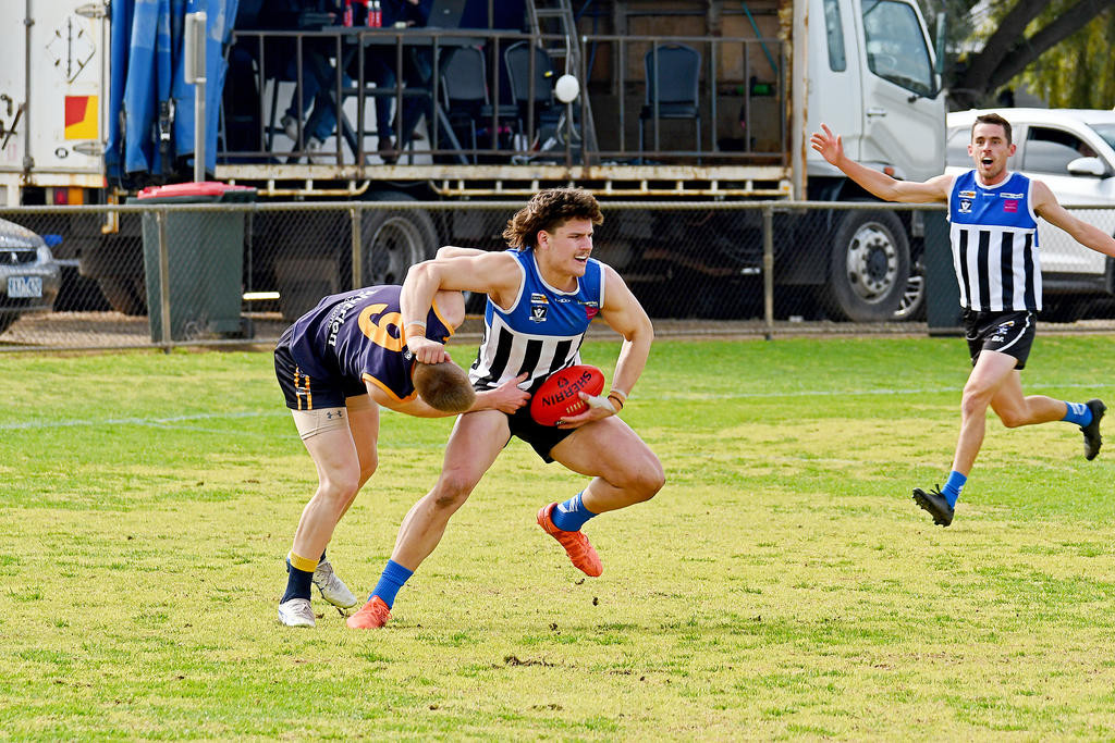 Oscar Gawith shows his strength.
