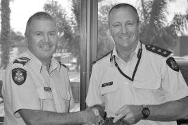 Leading senior constable Peter Taylor was awarded the Victoria Police Service Medal and National Medal Second Clasp in 2012, marking 35 years in the force. He is pictured with then-Inspector Trevor Ashton.