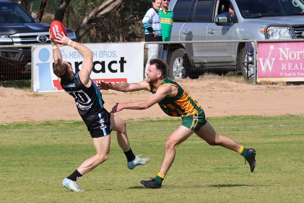 Jackson Fisher takes a strong mark.
