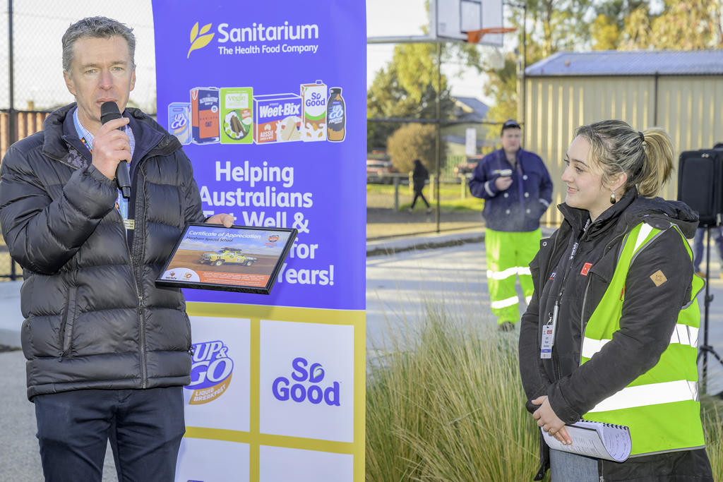 Horsham Special School principal Ben Tait receiving an appreciation award from Variety Bash official Piper Butcher.