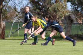 Dimboola Roos’ Victoria Ward and Yanac’s Mikalya Mackley contest the ball, with Lexi Farmers looking for the chance to assist.