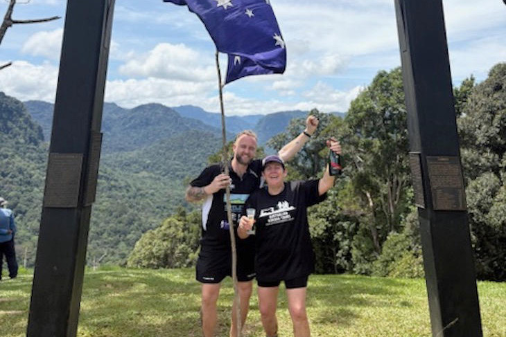 Dianne Marchment (right) has returned from Papua New Guinea where she completed the Kokoda Trail. She is pictured at the finish line with her son Lindsay (left).