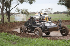 Rainbow couple Dean and Chantelle Petschel fly around a bend.
