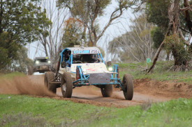 Mark Taylor and Ryder Taylor send the mud flying.
