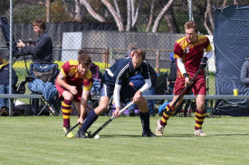 Yanac Tigers’ Brad Alexander drags the ball away from his Hoops opponent Jayden Smith, with Hoops captain Sandon Schultz waiting for a chance to tackle.