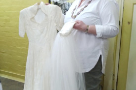 Pam Clugston with a wedding dress from 1954 and a brand new material imported from the USA.