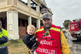 Daniel Floyd with his and Tenae Mott’s son Kade, the morning after the fire at Minapre. Tenae is devastated Kade will never get to experience the pub like she did growing up.
