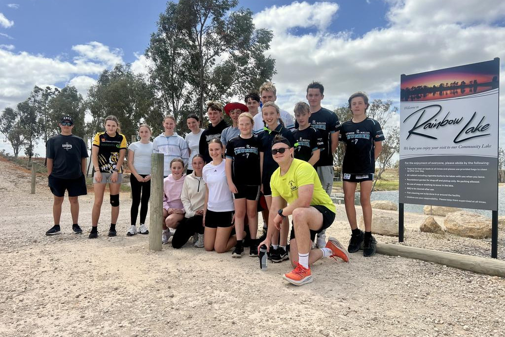 Dozens of Rainbow P-12 College students welcomed Lochlan Stenhouse (Dimboola Teacher) at the Rainbow Lake. Then they ran the last three kilometres along with him to the school, where the whole school applauded and appreciated Mr Stenhouse's effort. Photo: TAYYAAB MASROOR