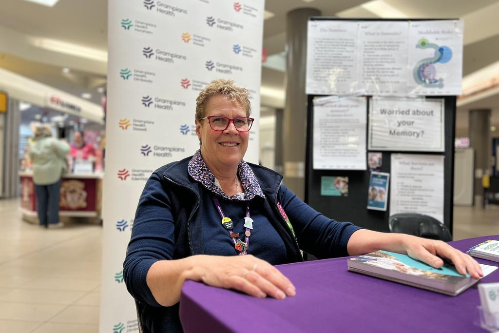 Grampians Health memory support nurse, Cathy Ryan, chats with community members at her information desk at Horsham Plaza last month, raising awareness about local dementia services and early diagnosis.