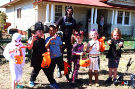 Tom, Natas, Roger, Tyler, Nylah, Maryjane and Nixon after collecting edibles from one of the houses in town.