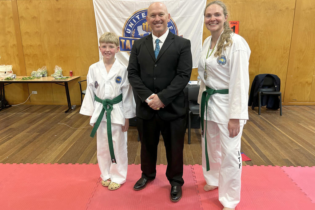 Buloke Taekwon-do Joshua (left) and Lisa Woods with grand master ninth dan Michael Muleta at the United ITF National Championships.