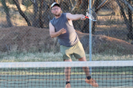 Rainbow’s Nathan Cocks unleashes a serve.