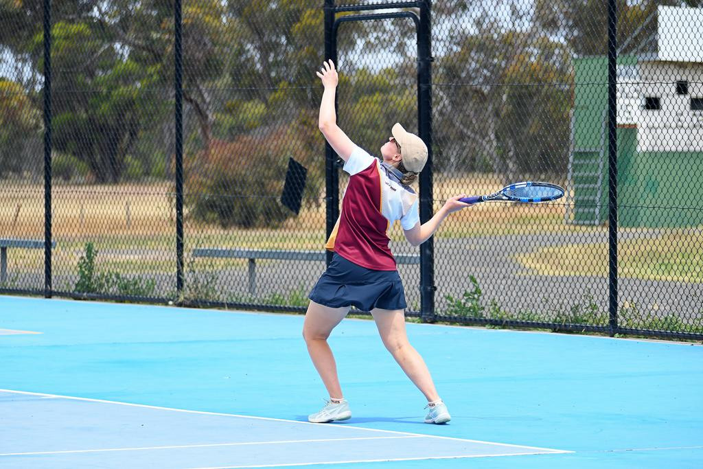 Warrack's Lauren Kellett coils up for a serve.