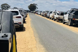 Hundreds of vehicles lined the narrow country road at the farmgate protest against the VNI-West transmission line crossing farmland in Western Victoria.