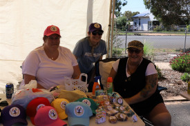 SUPPORTING ALL ABILITIES: Allira, Naomi, and Johana held their Rainbow Innovation Centre stall. Photo: LES GRAETZ.